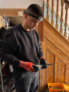 Electrician carrying out Zs testing during electrical inspection in London