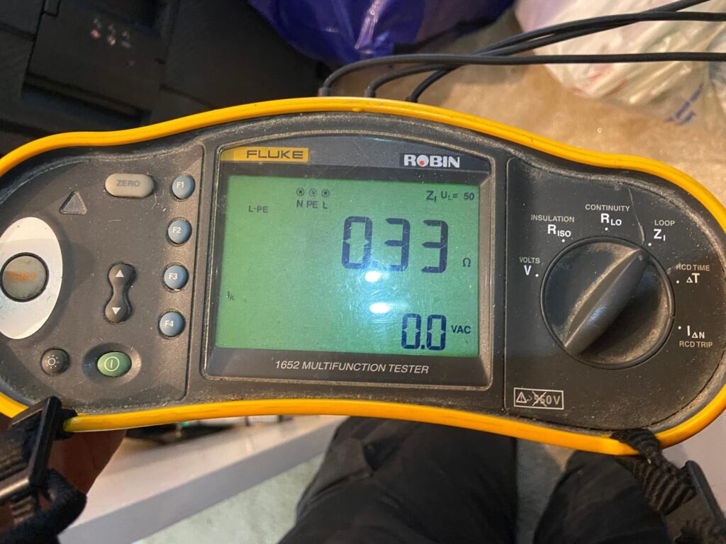 Failed Zs test on Fluke multifunction tester showing high earth fault loop impedance caused by loose earth connection during electrical inspection in London.