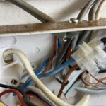 Close-up of circuit wiring and connector blocks found during EICR inspection in Acton