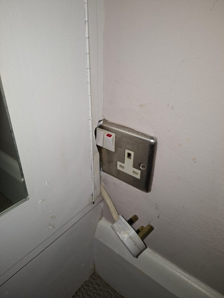 Damaged socket found during EICR in Chiswick