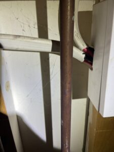 C2 defect found during an EICR in Chiswick: shower cable sheath exposed