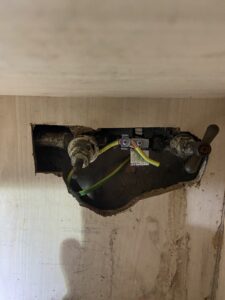 Main bonding fitted to water pipes after an EICR in Chiswick