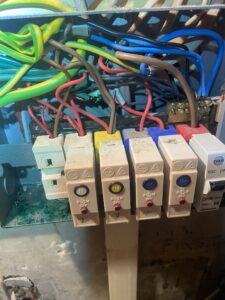 Old Wylex fuse board with no RCD protection found during an EICR in Chiswick