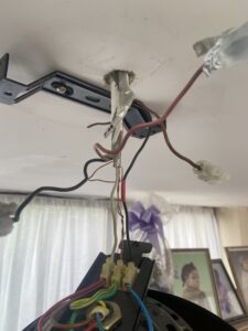 Bare earth wires without sleeving found during an EICR in Chiswick
