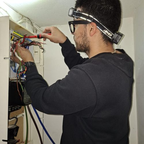 NAPIT-approved electrician upgrading a fuse board in a London rental property