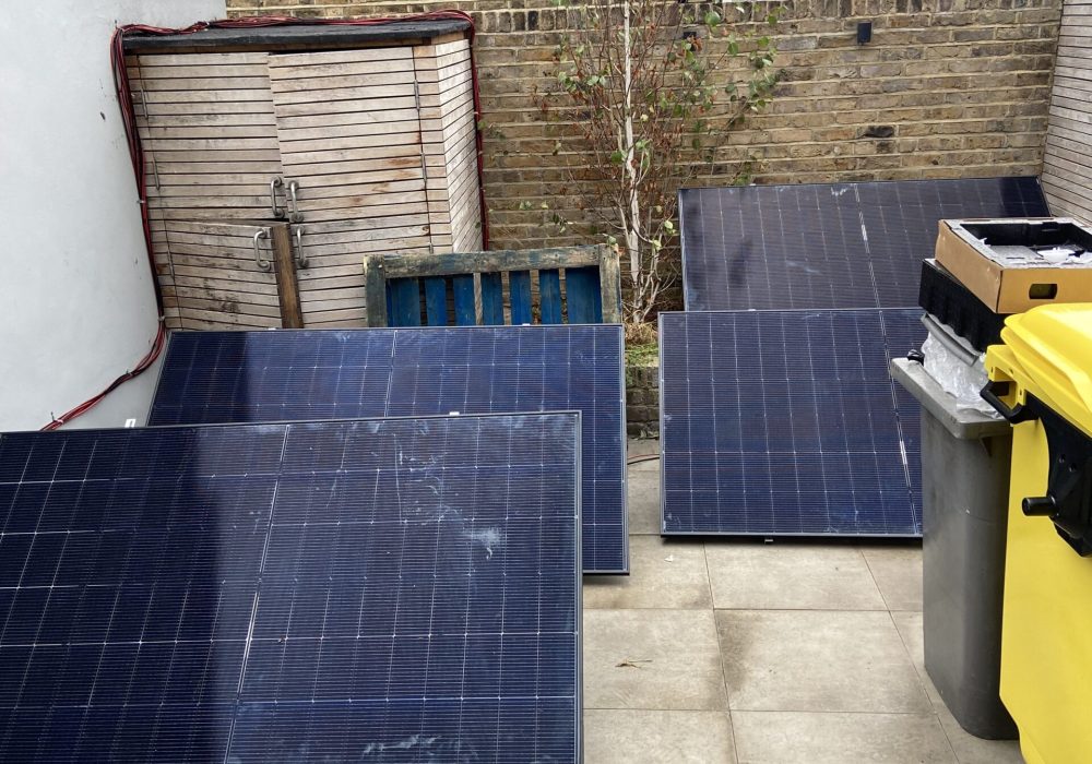 Solar panels ready for a ground-mounted Anker SOLIX Solarbank 4 installation in a London garden