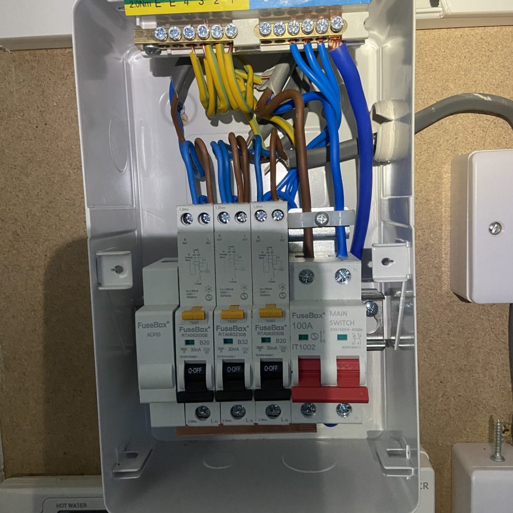 Wiring inside a new loft fuse board installed in Acton