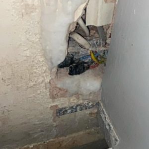 Exposed electrical cable without IP-rated protection found during electrical fault finding in Ealing, London