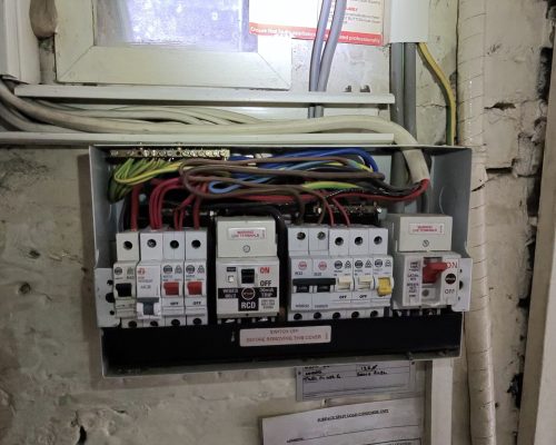 Old consumer unit in Putney property with mixed RCD and MCB protection before upgrade